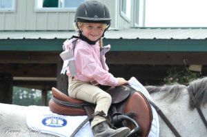 Brooke Silver, 5, at a horse show - her mother says she's "obsessed" with riding and showing.