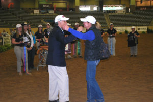 Carla Wennberg embraces IHSA Executive Director Bob Cacchione after being named Western Coach of the year at IHSA Nationals. (Contributed photos)