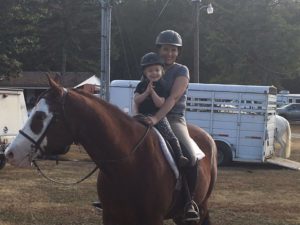 "The Collective Equestrian" editor Liz Crumbly with her daughter on their Quarter Horse, "Cheyenne."